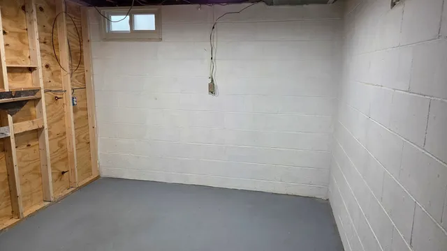 a utility room with cabinets and washer