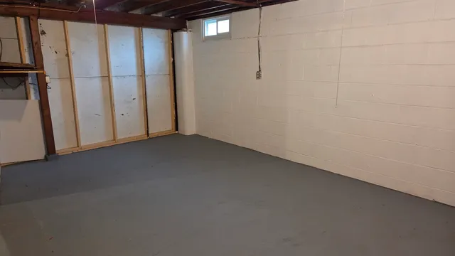 a view of house with backyard and seating area