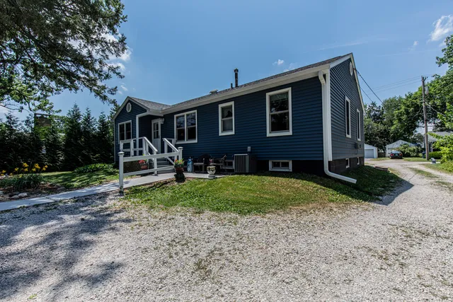 a front view of a house with garden
