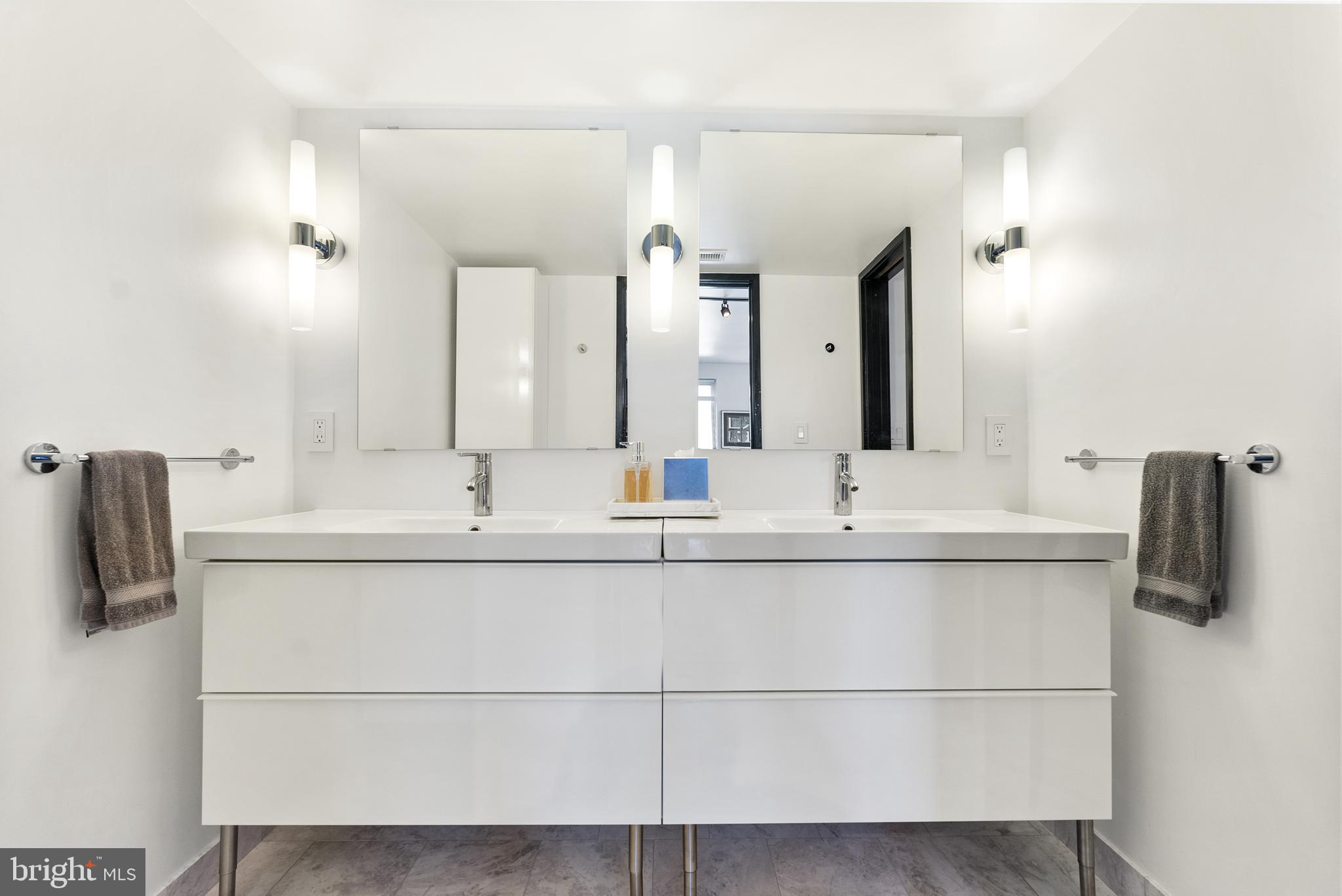 3210 Grace Street Northwest, Unit 304 Washington, DC 20007 - Photo 20 of 41 a bathroom with a sink and a mirror