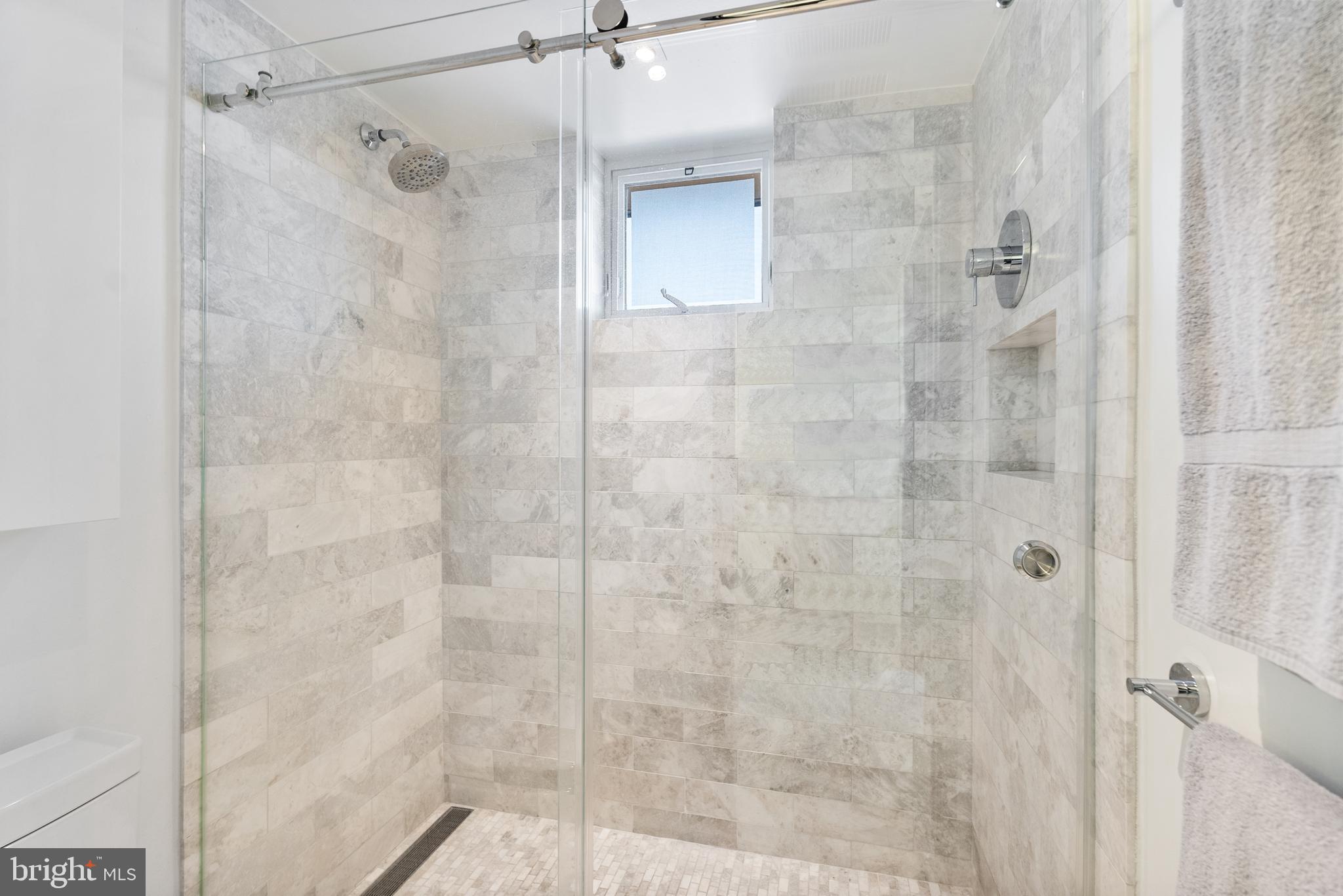 3210 Grace Street Northwest, Unit 304 Washington, DC 20007 - Photo 22 of 41 a bathroom with a shower