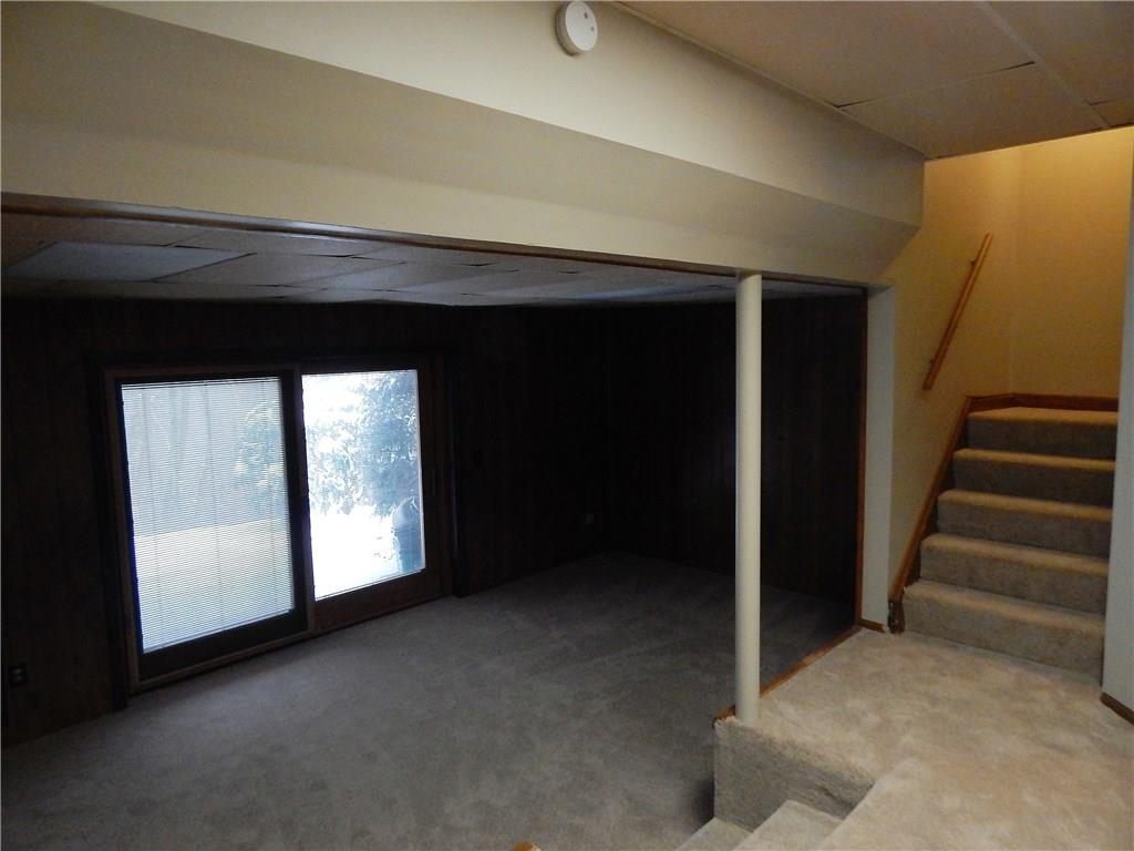 220 Falls Village Road Pittsburgh, PA 15239 - Photo 22 of 24 SUNKEN GAMEROOM WITHSLIDING DOOR TO PATIO AND WOODED REAR YARD.