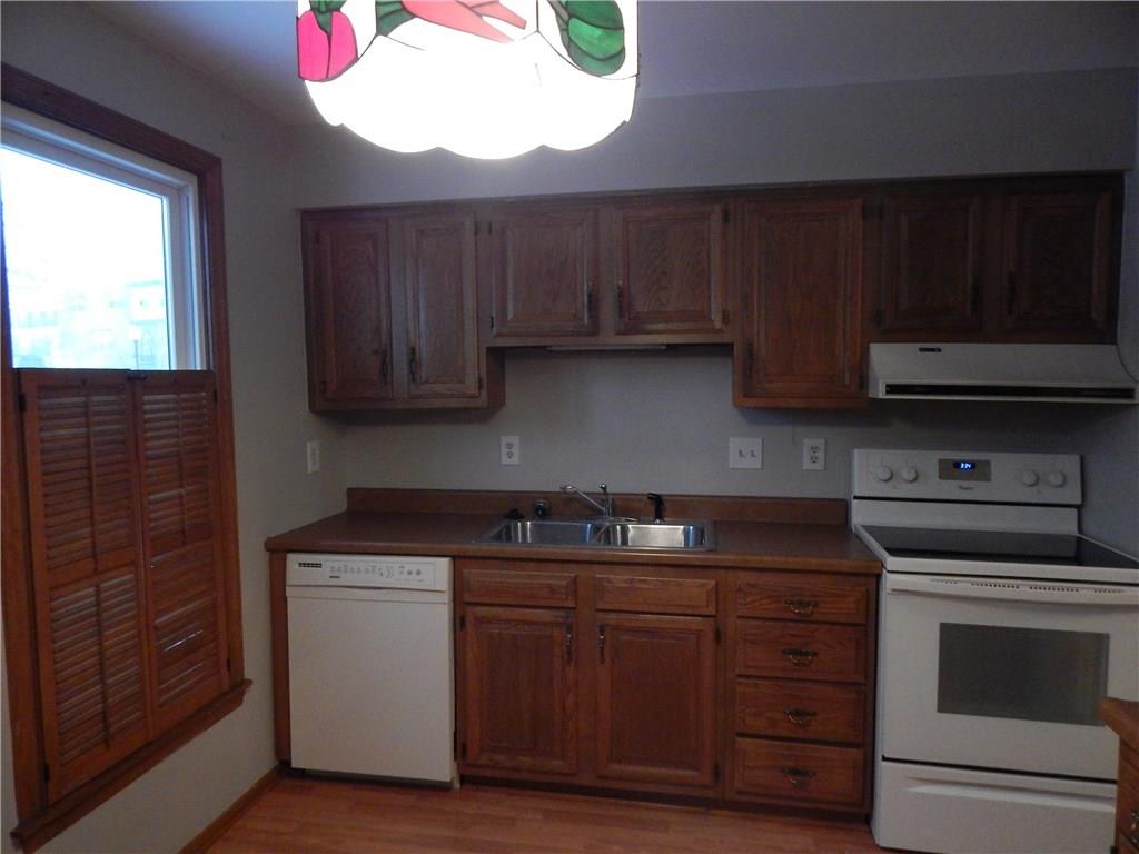 220 Falls Village Road Pittsburgh, PA 15239 - Photo 7 of 24 EAT-IN-KITCHEN WITH AN ELECTRICSTOVE AND DISHWASHER INCLUDED.