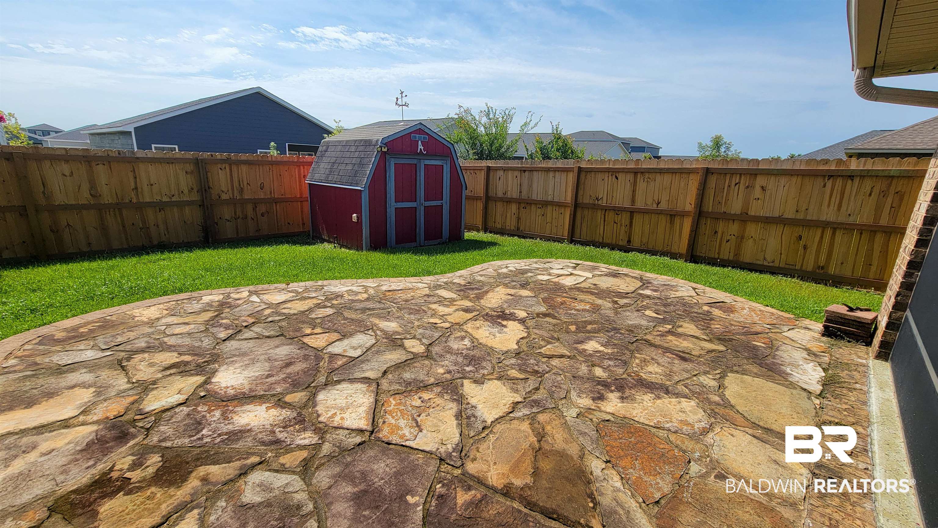 1704 Arcadia Drive Foley, AL 36535 - Photo 39 of 52 Fenced backyard featuring a patio area and a storage unit