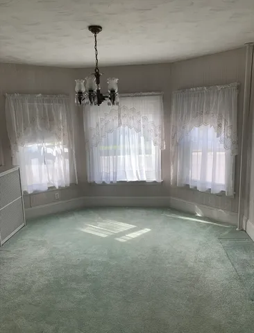 a view of empty room with windows