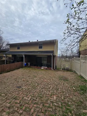 a view of a yard with an outdoor seating