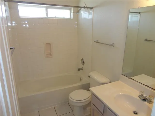 a view of a swimming pool with a yard