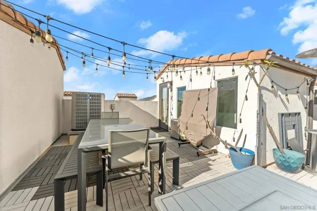 a view of a patio with table and chairs