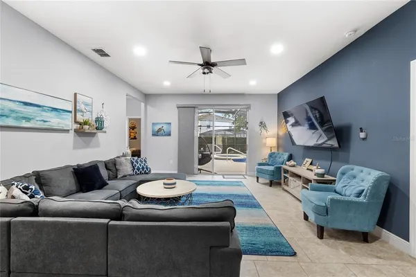 a kitchen with stainless steel appliances granite countertop a stove top oven a sink dishwasher and a refrigerator