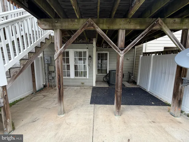 a view of a house with wooden stairs