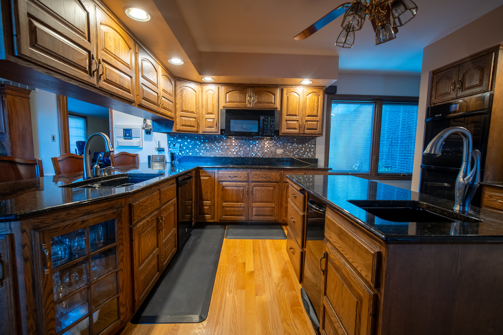 3065 182nd Place Lansing, IL 60438 - Photo 11 of 38 a kitchen with stainless steel appliances granite countertop a stove a sink and a microwave