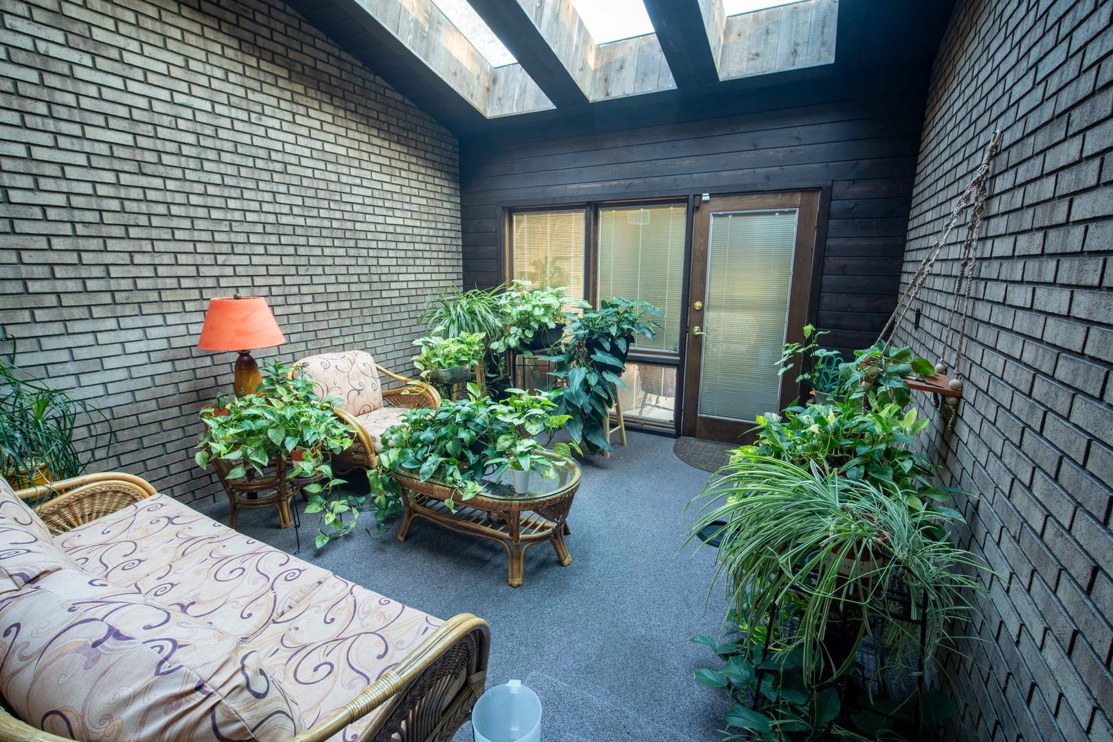 3065 182nd Place Lansing, IL 60438 - Photo 14 of 38 a view of a backyard with chairs and flower plants