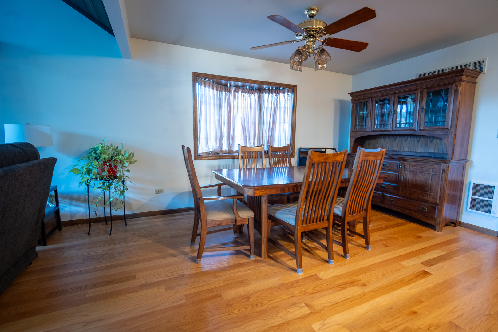 3065 182nd Place Lansing, IL 60438 - Photo 10 of 38 a view of a dining room with furniture and a potted plant