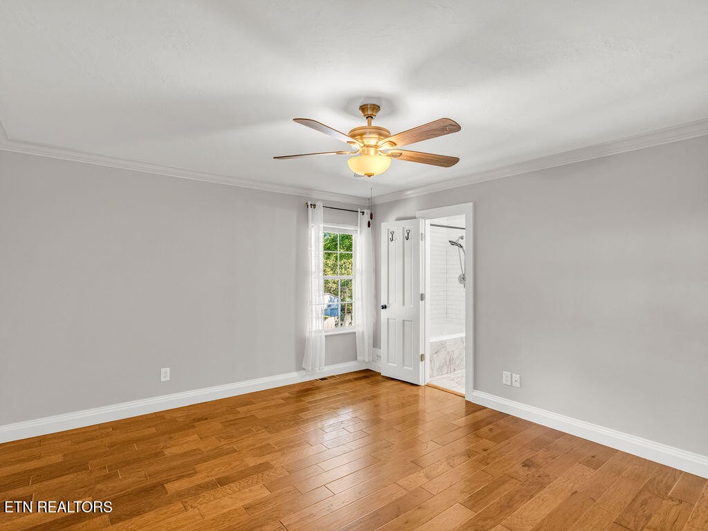 170 Cedar Circle Powell, TN 37849 - Photo 11 of 27 wooden floor in an empty room with a window