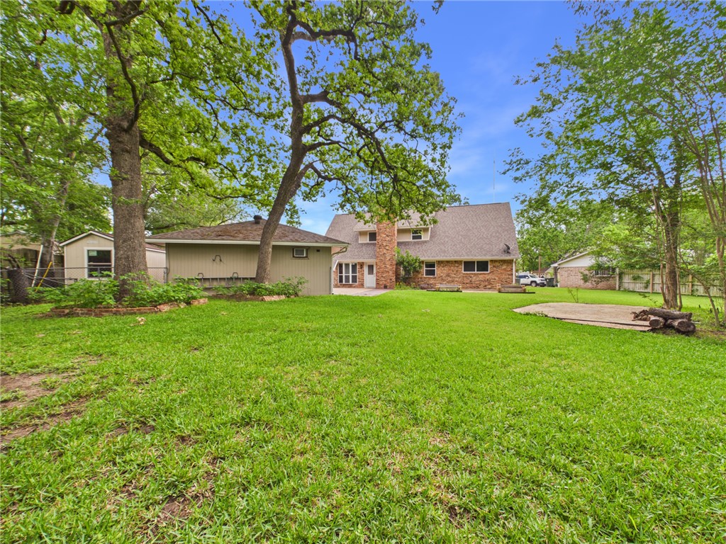 902 Briar Bend Court Bryan, TX 77802 - Photo 37 of 39 a front view of a house with garden