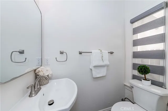 a large kitchen with lots of counter space dining table and stainless steel appliances