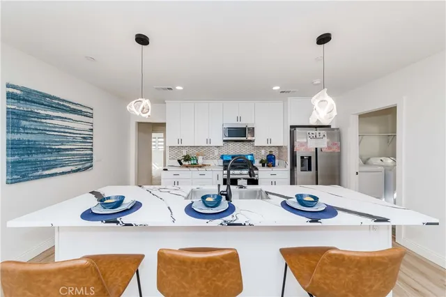 a bathroom with a sink toilet tub and shower