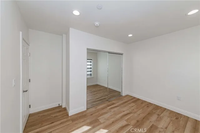 a view of a room with a wooden floor