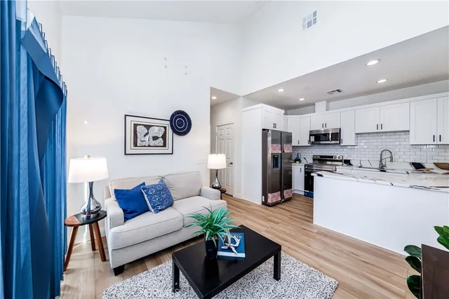 a view of a house with backyard and sitting area