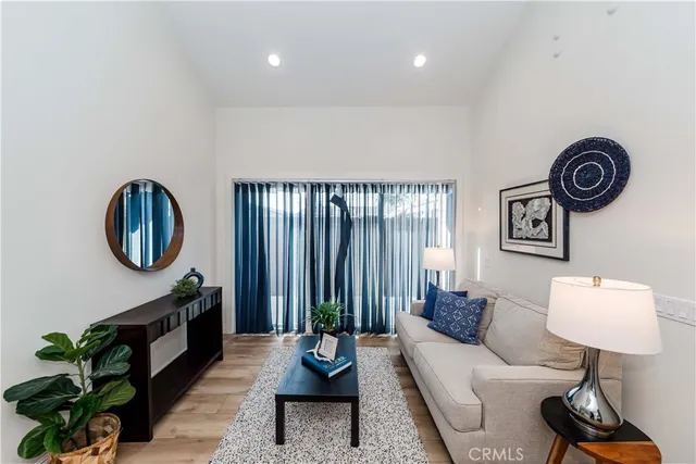 a living room with furniture and a red chair