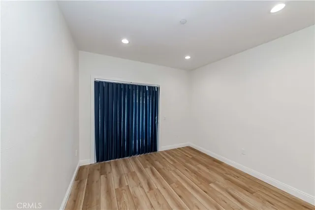 a view of a hallway with washer and dryer