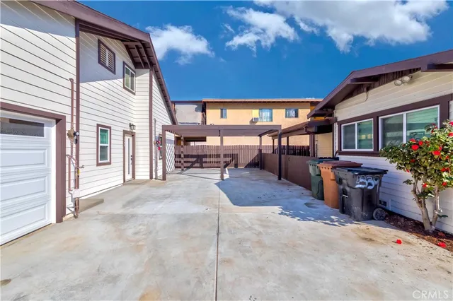 a view of a backyard with sitting area