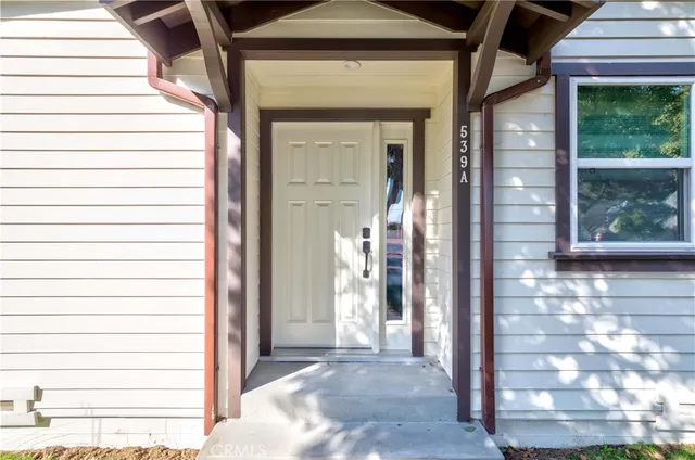 a front view of a house with a glass door