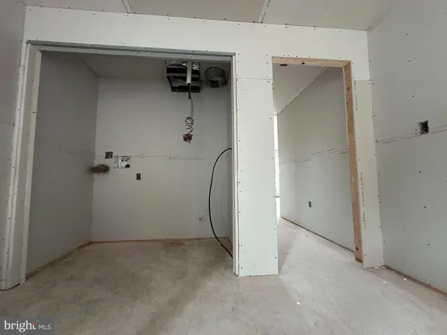 a view of a room with a walk in closet