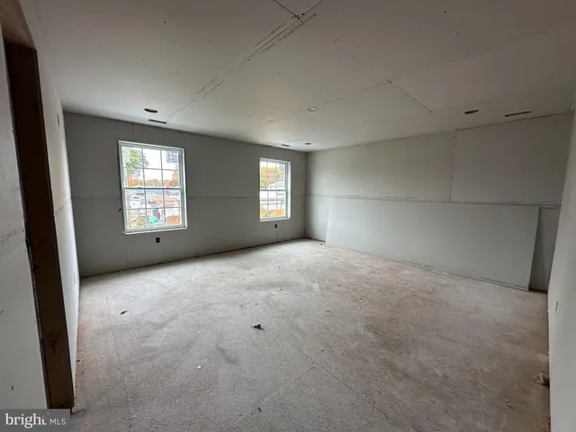 en empty room with windows