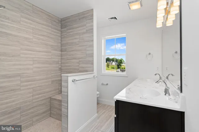 a bathroom with a sink a vanity and a mirror