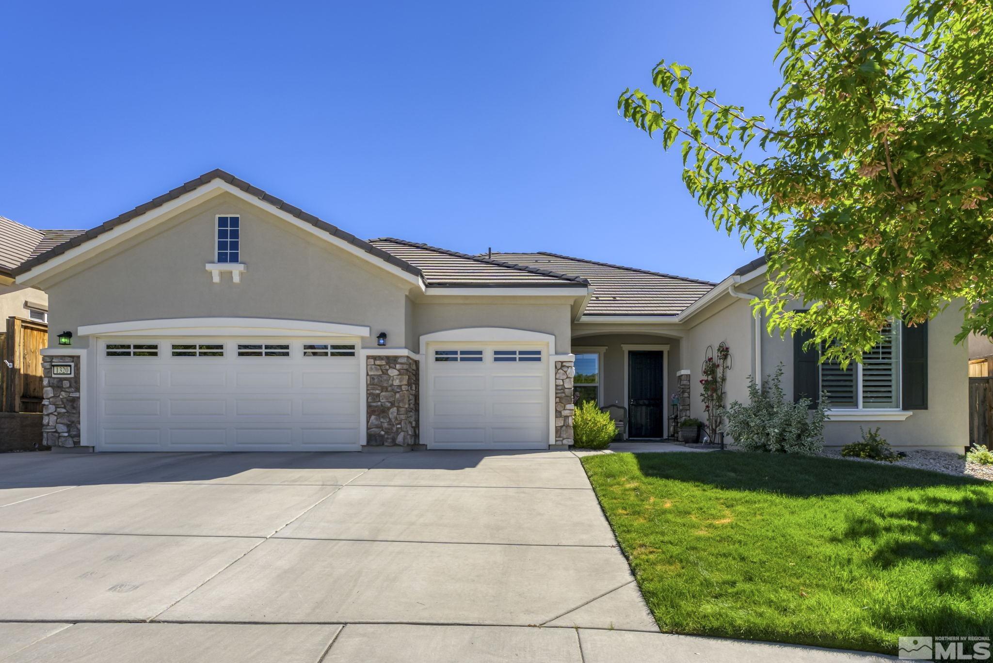 1320 Winterchase Way Reno, NV 89523 - Photo 1 of 37 a front view of a house with a garden