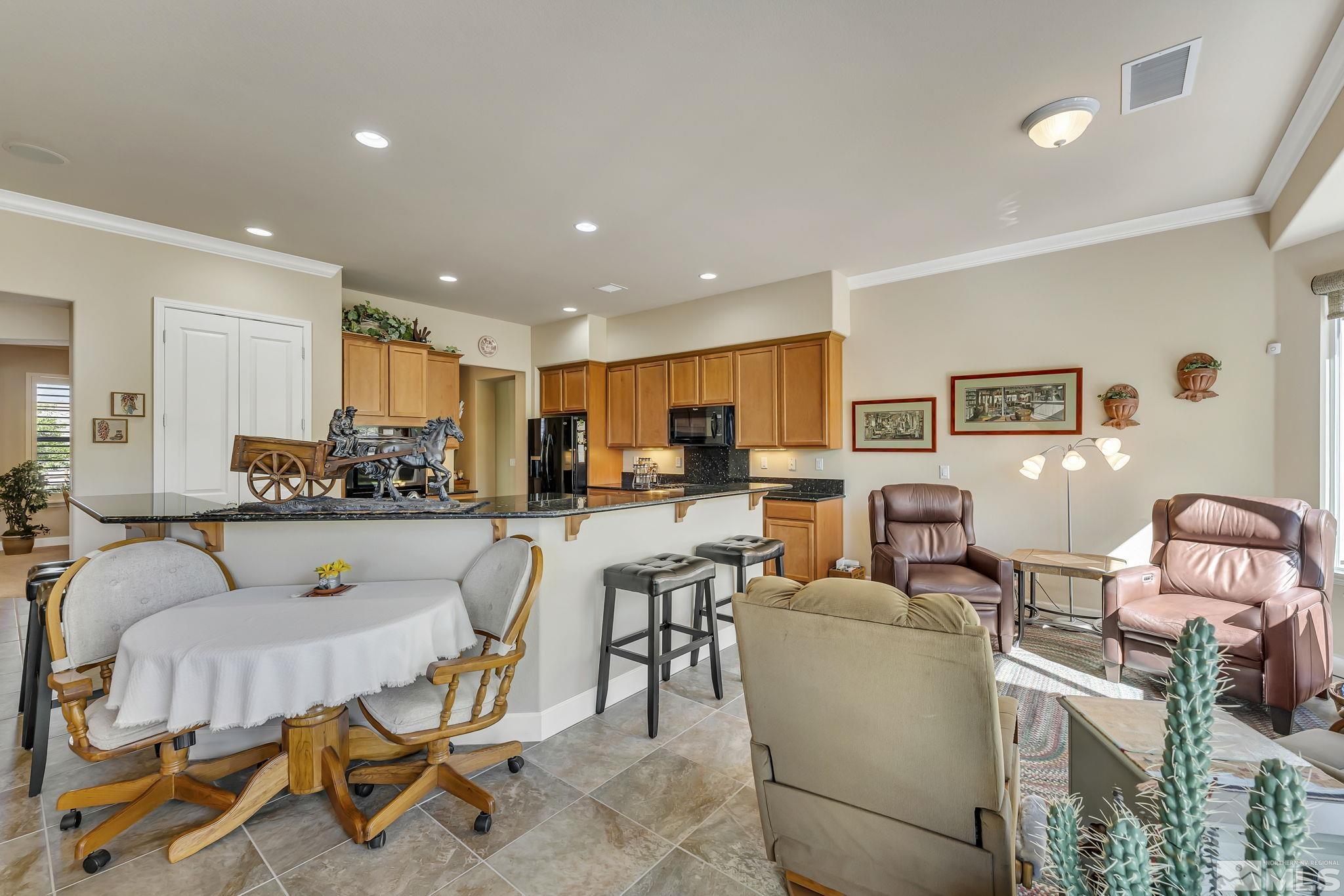 1320 Winterchase Way Reno, NV 89523 - Photo 13 of 37 a living room with furniture and a dining table with kitchen view