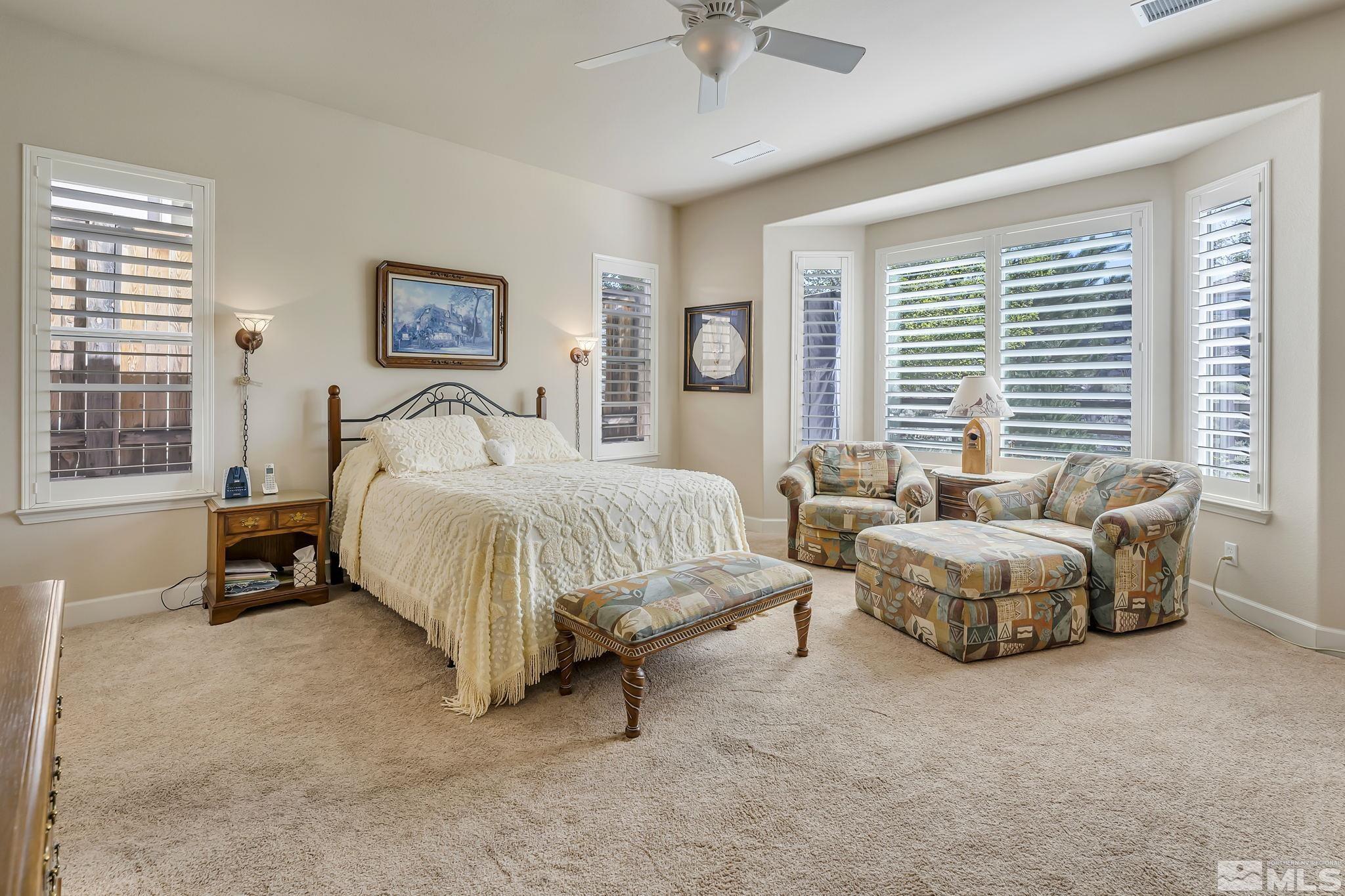 1320 Winterchase Way Reno, NV 89523 - Photo 19 of 37 a spacious bedroom with bed and a large window