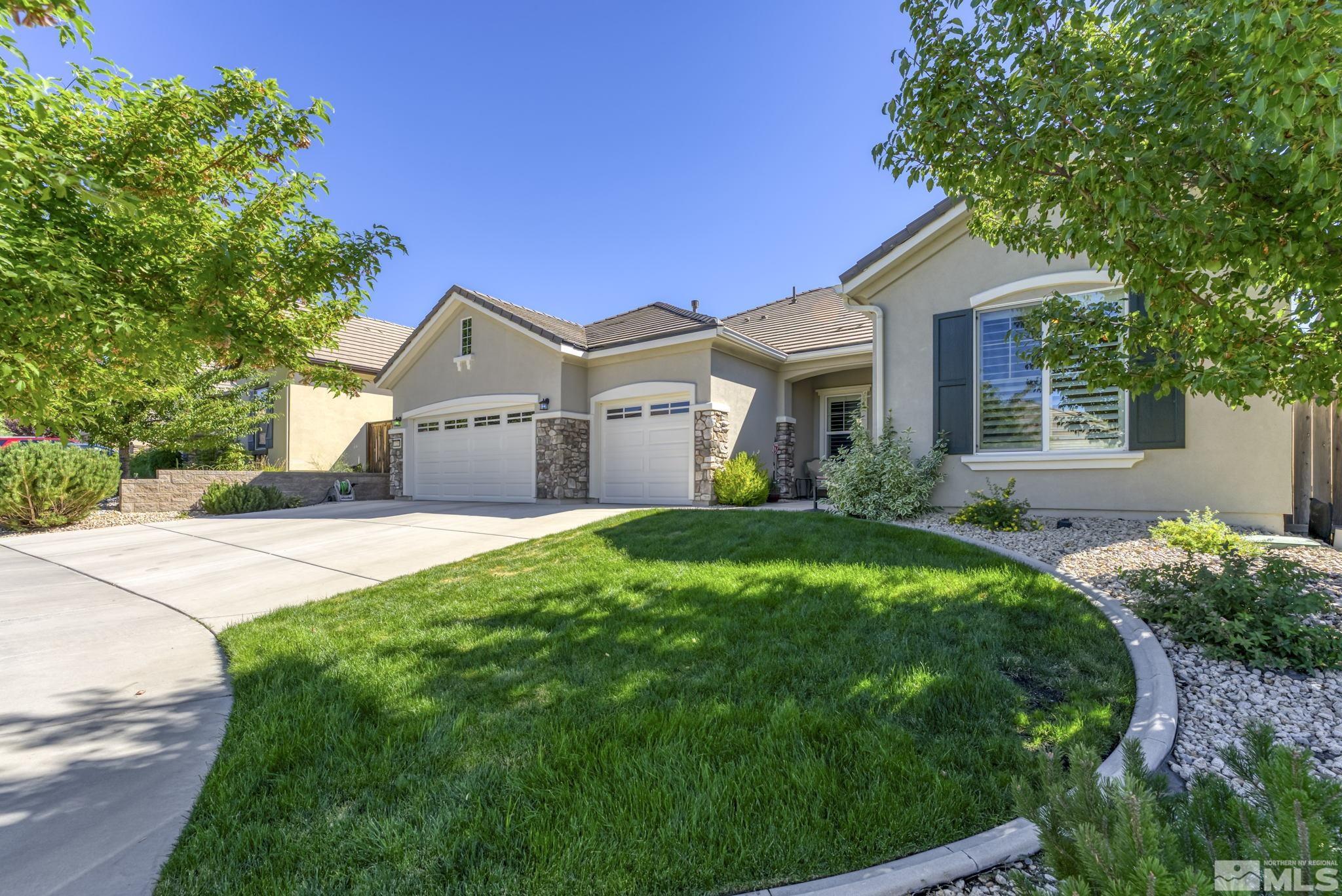 1320 Winterchase Way Reno, NV 89523 - Photo 2 of 37 a front view of a house with a yard and garage
