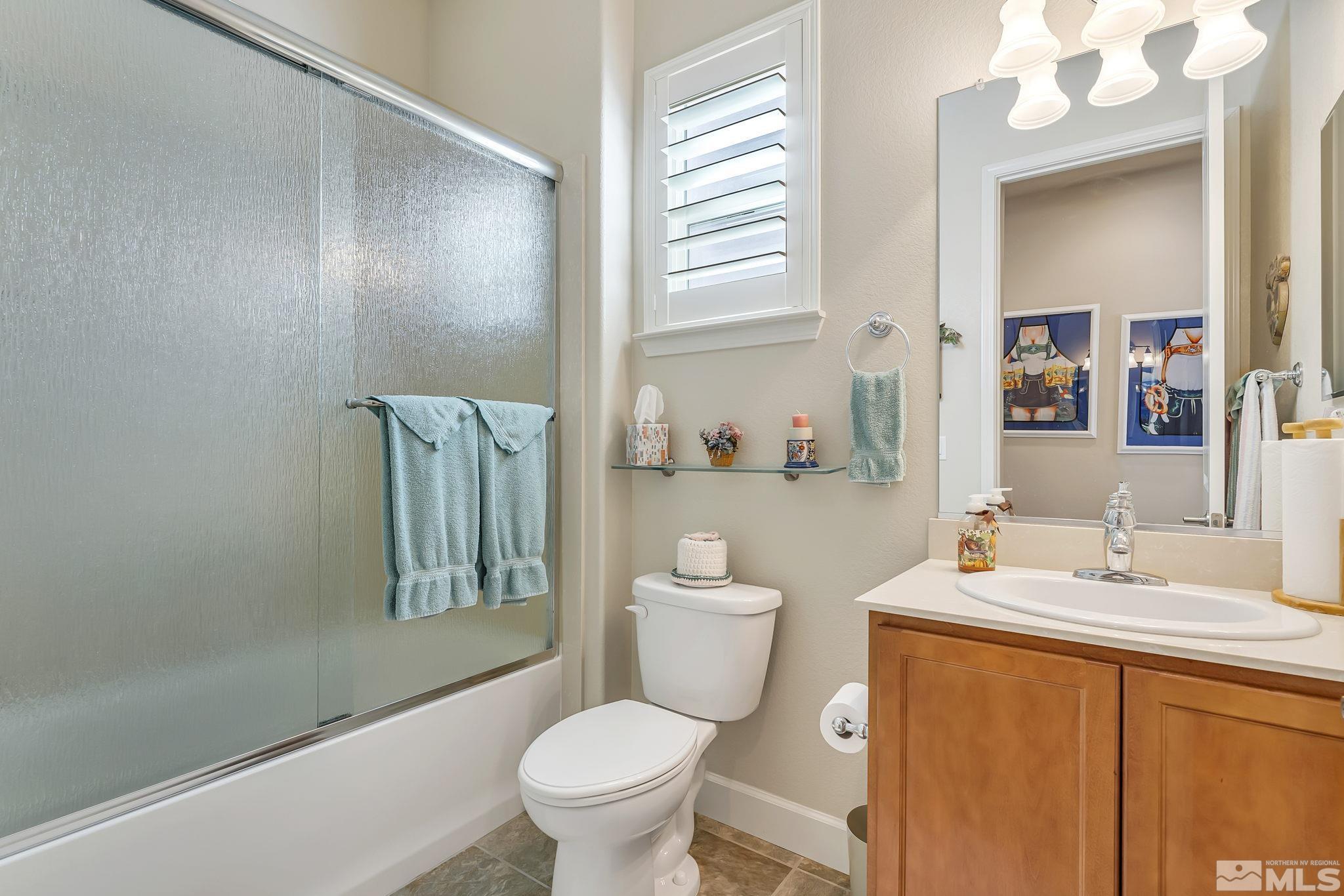 1320 Winterchase Way Reno, NV 89523 - Photo 26 of 37 a bathroom with a sink a toilet and shower