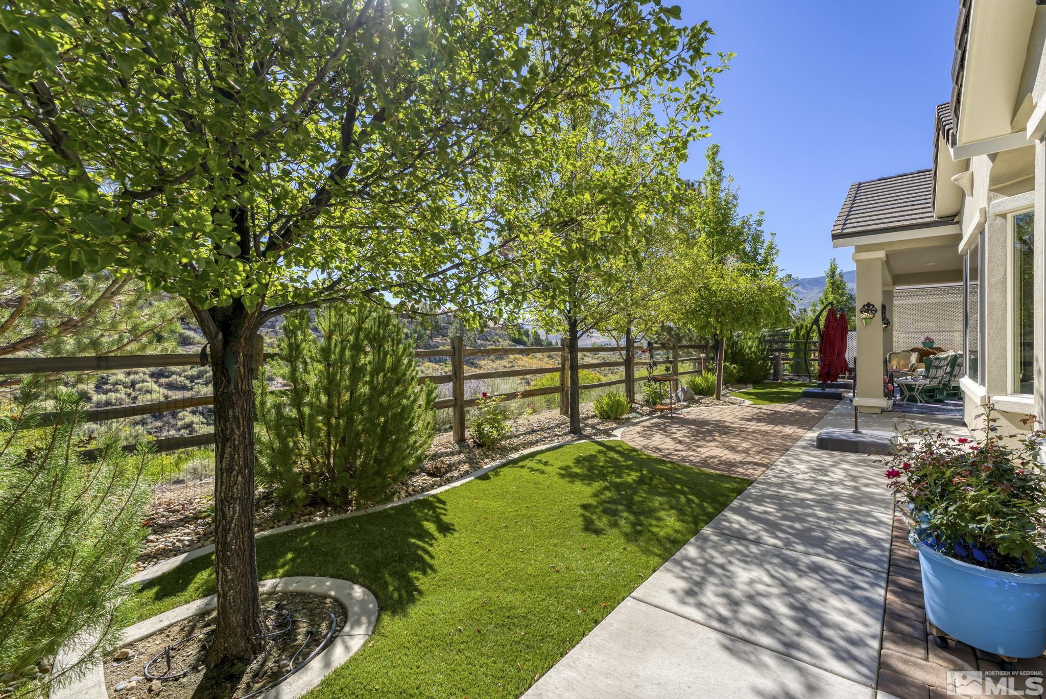 1320 Winterchase Way Reno, NV 89523 - Photo 36 of 37 a view of a garden with a bench in the garden
