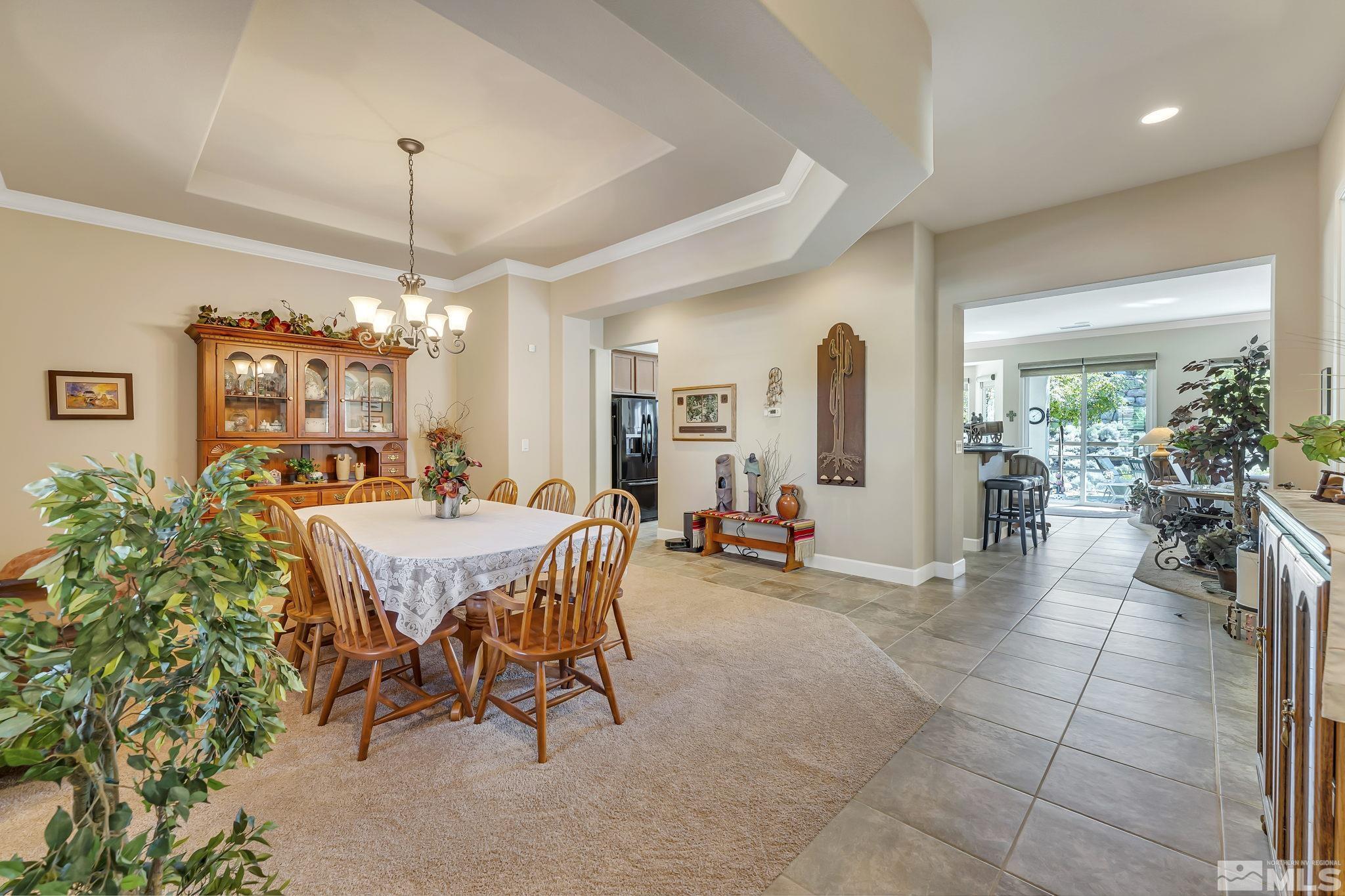 1320 Winterchase Way Reno, NV 89523 - Photo 5 of 37 a dining room with furniture and chandelier or chandelier