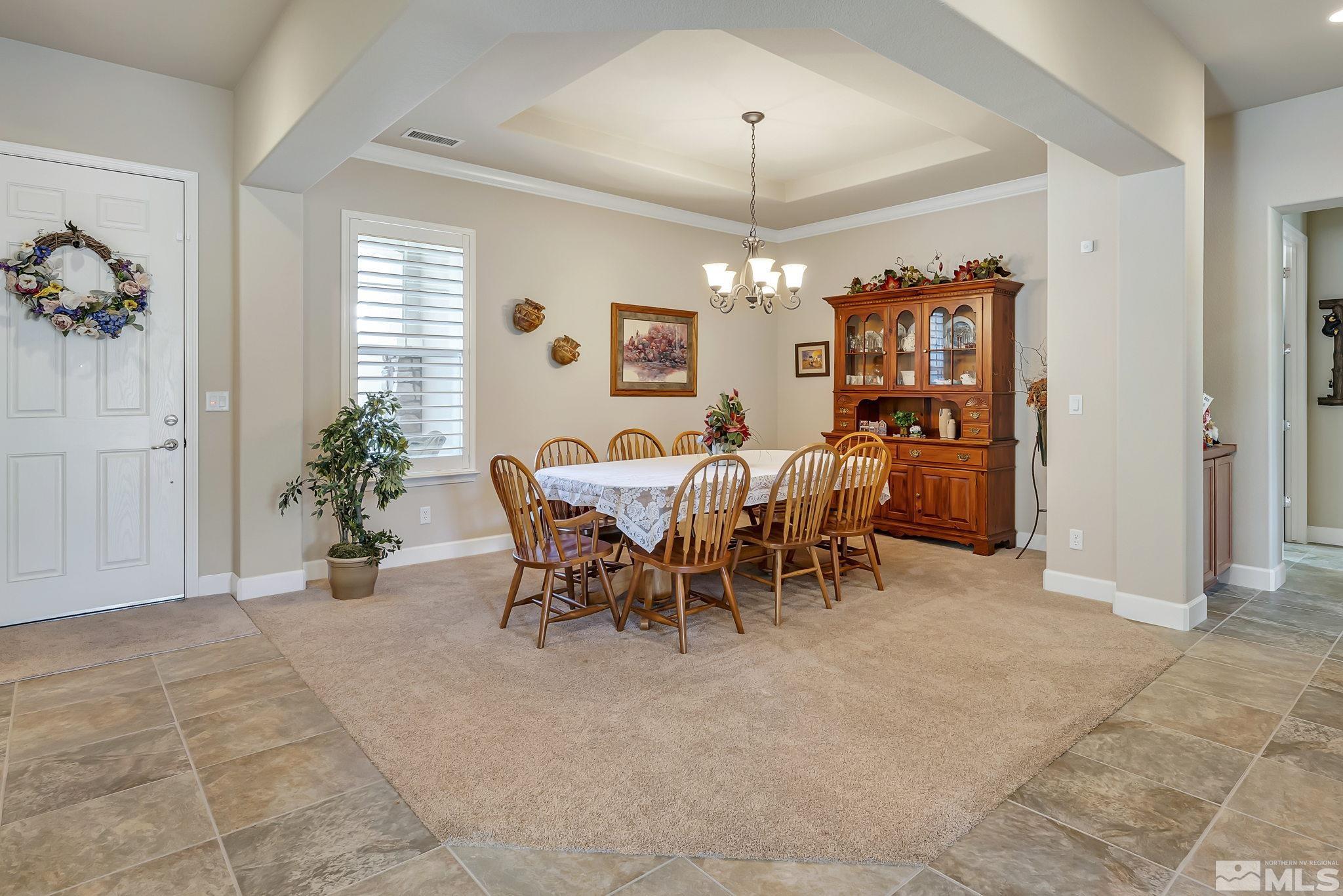 1320 Winterchase Way Reno, NV 89523 - Photo 6 of 37 a view of a dining room with furniture and chandelier