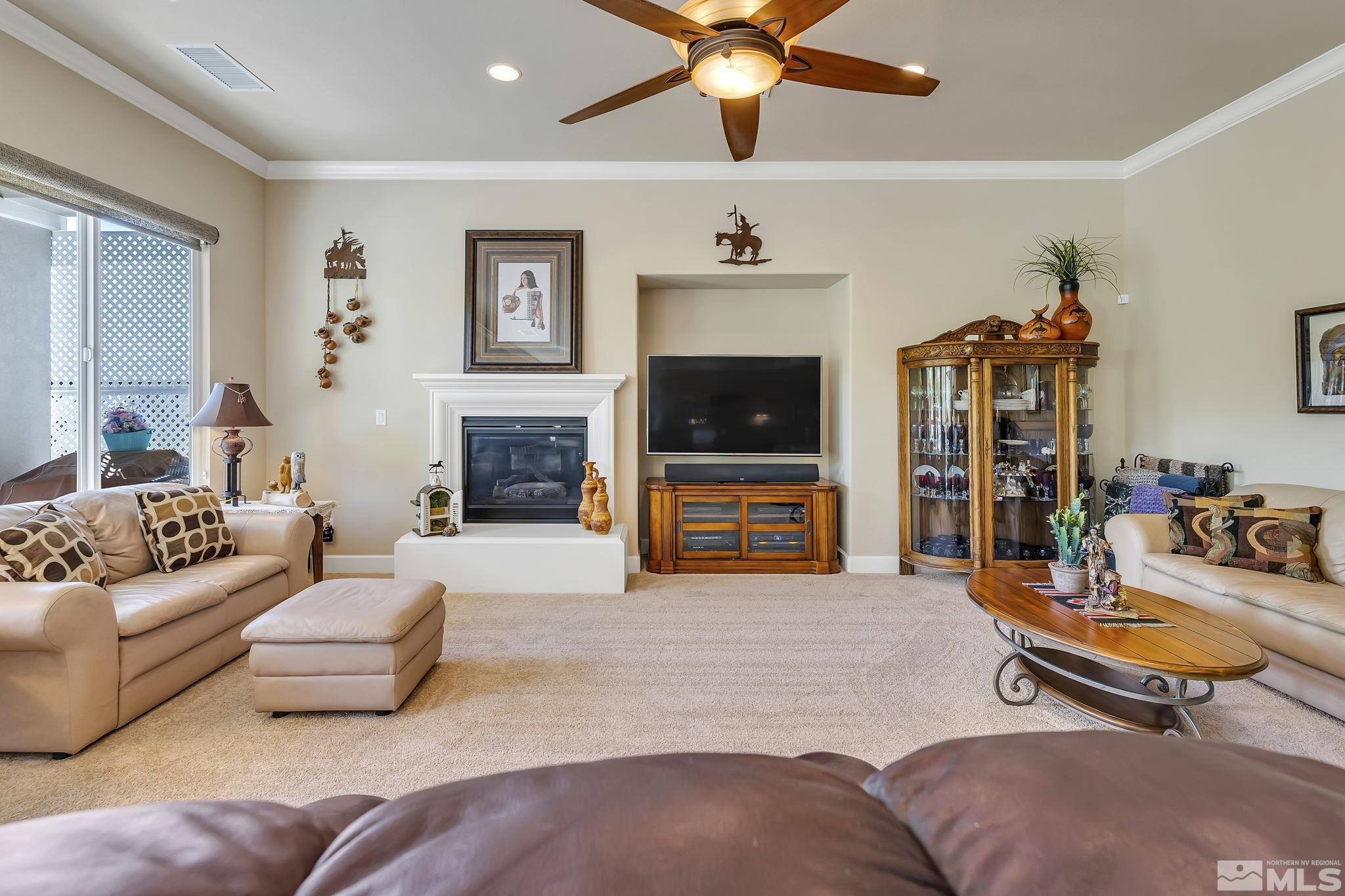 1320 Winterchase Way Reno, NV 89523 - Photo 7 of 37 a living room with furniture and a flat screen tv