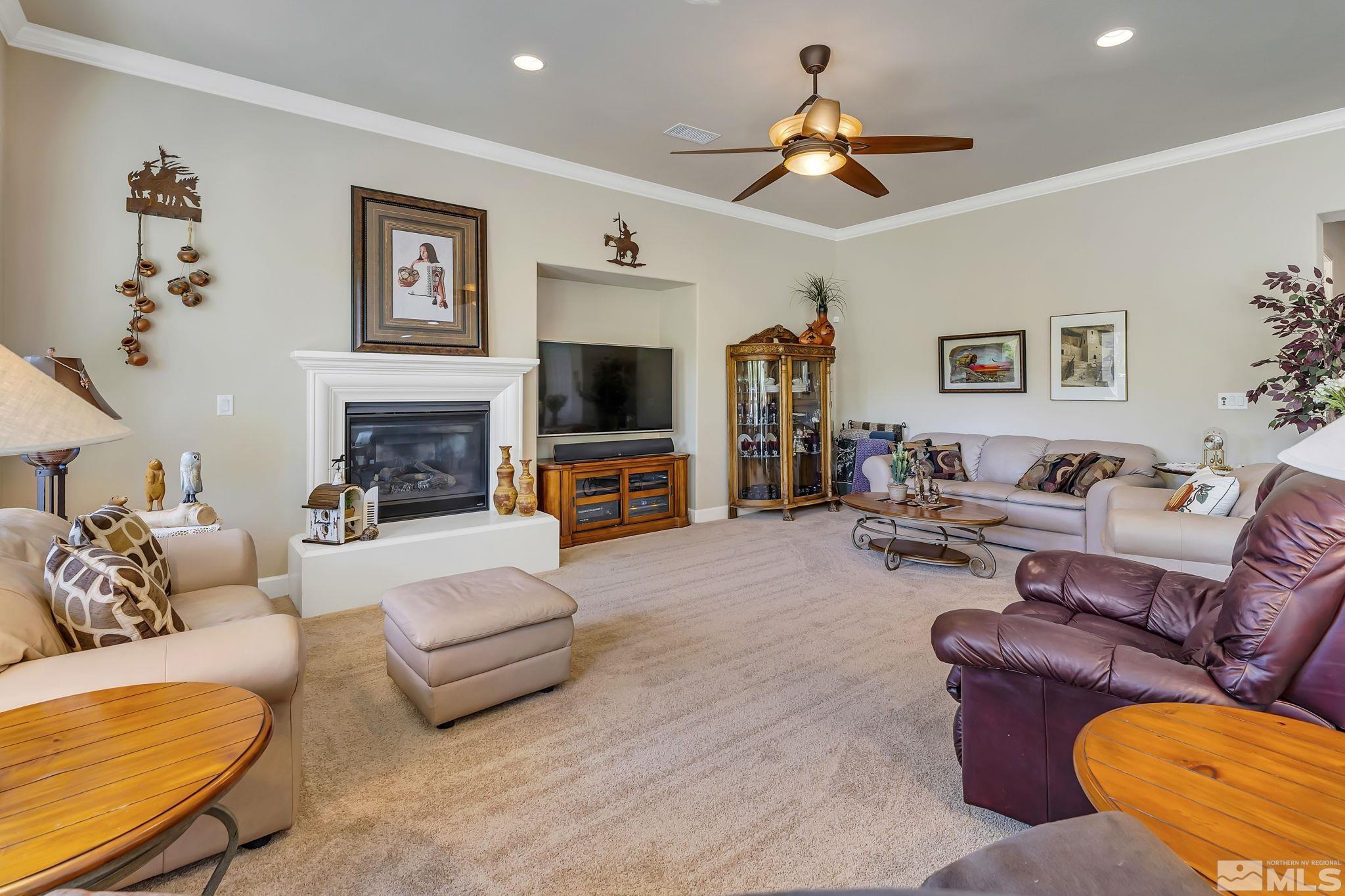 1320 Winterchase Way Reno, NV 89523 - Photo 8 of 37 a living room with furniture fireplace and a flat screen tv