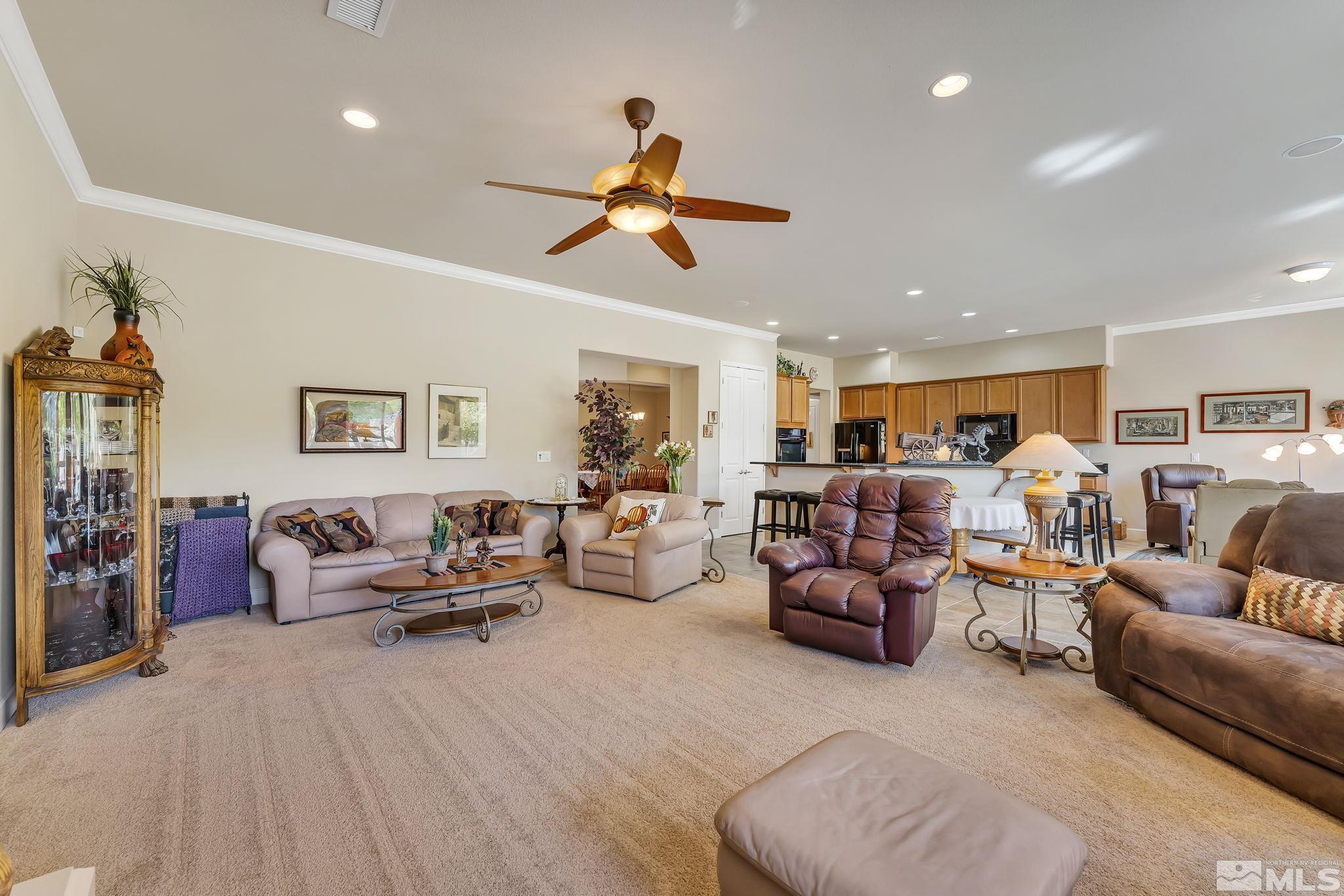 1320 Winterchase Way Reno, NV 89523 - Photo 9 of 37 a living room with furniture kitchen view and a wooden floor