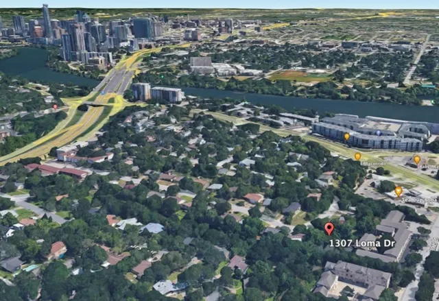 an aerial view of residential houses with outdoor space and swimming pool