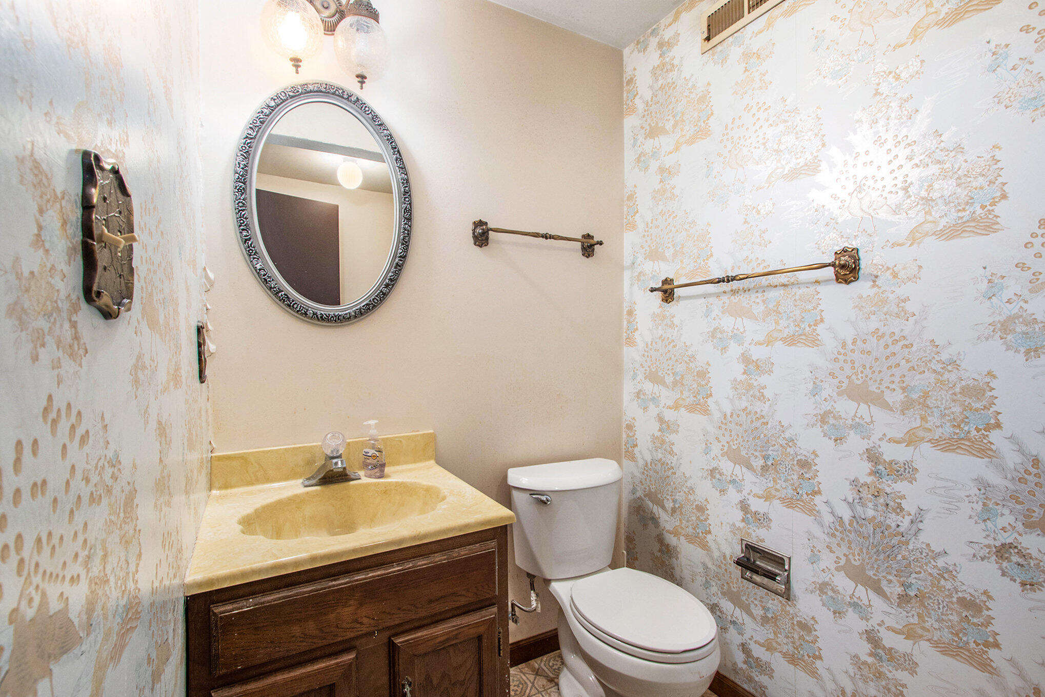 2091 Hidden Valley Drive Crown Point, IN 46307 - Photo 22 of 38 a bathroom with a sink a toilet and a mirror