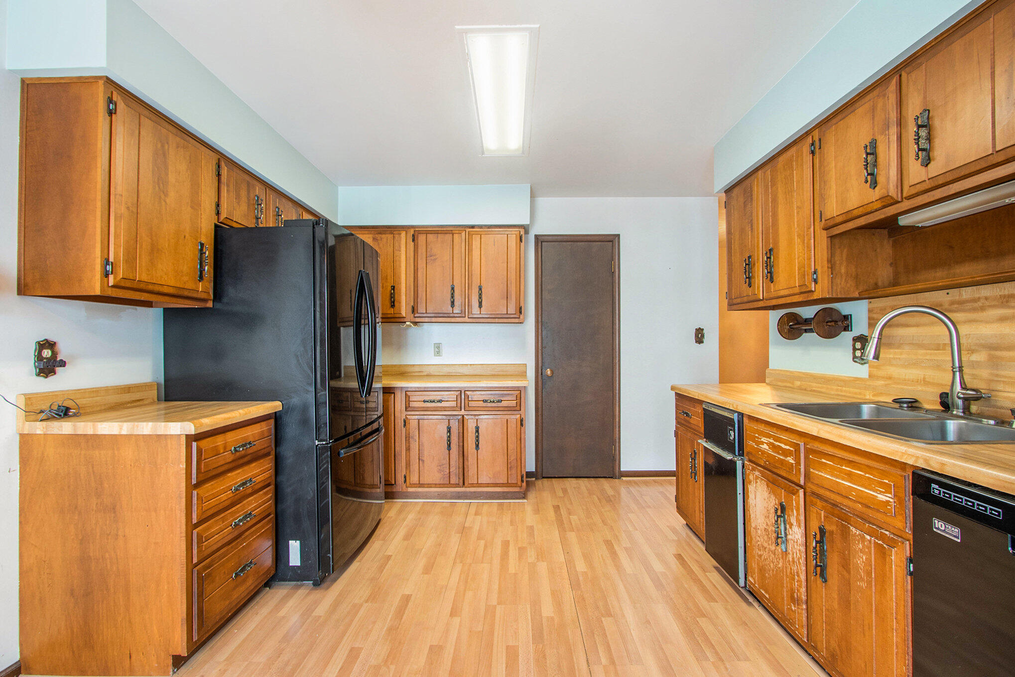 2091 Hidden Valley Drive Crown Point, IN 46307 - Photo 7 of 38 a kitchen with stainless steel appliances granite countertop a sink stove and refrigerator