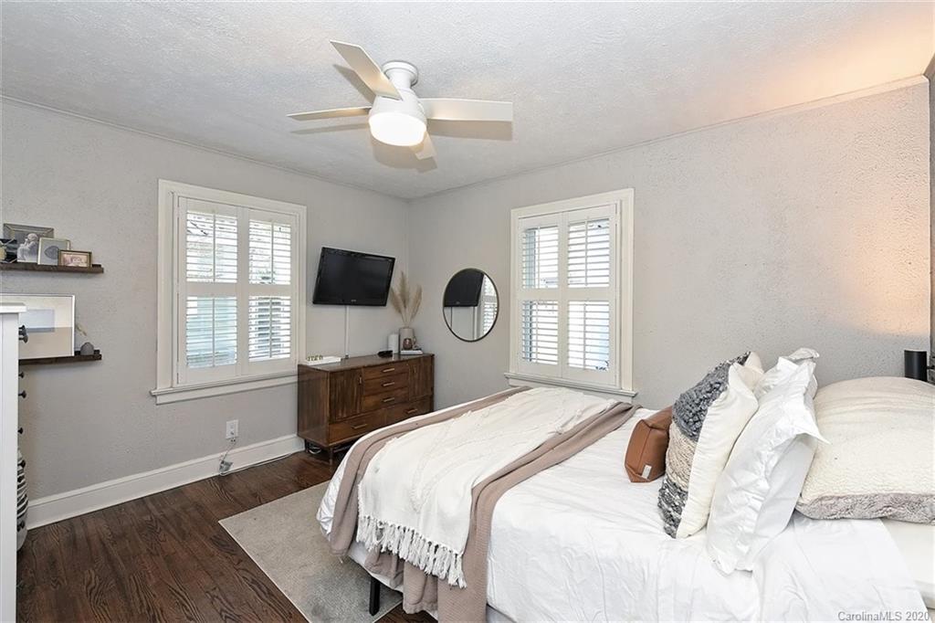 1508 Chippendale Road Charlotte, NC 28205 - Photo 15 of 28 a bedroom with a bed tv and window