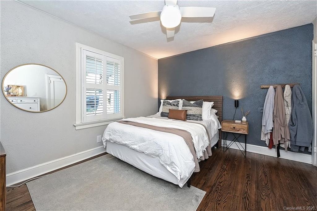 1508 Chippendale Road Charlotte, NC 28205 - Photo 16 of 28 a bedroom with a large bed and a large window