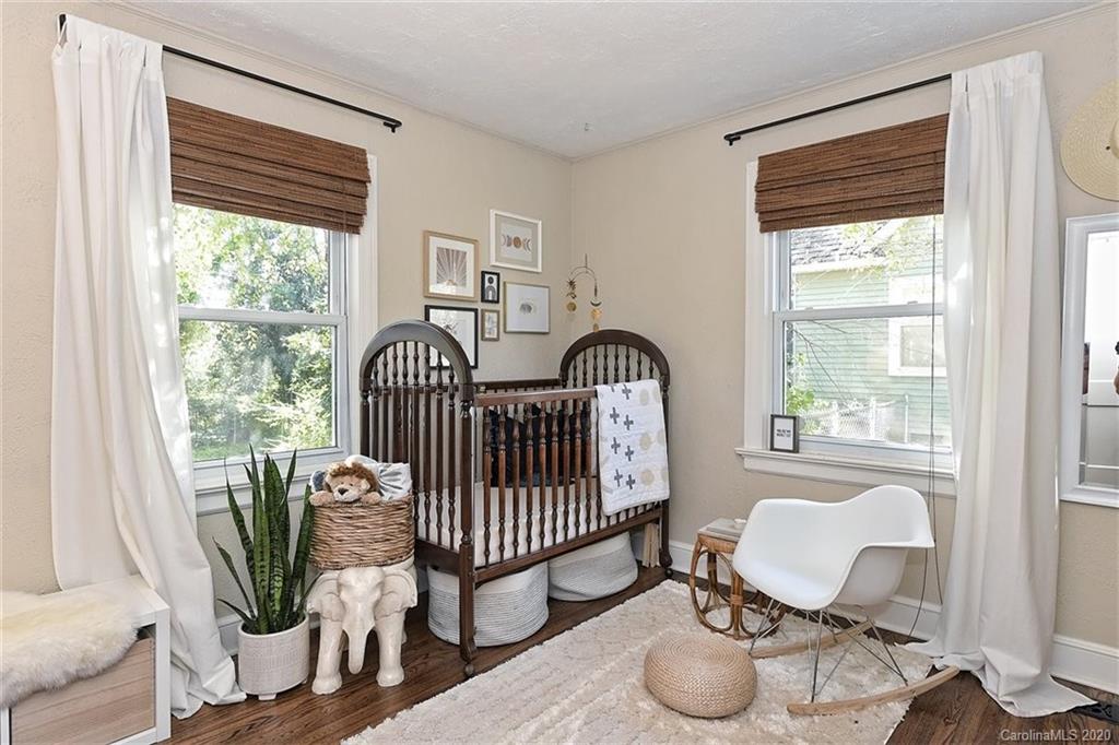 1508 Chippendale Road Charlotte, NC 28205 - Photo 19 of 28 a bedroom with furniture and a window