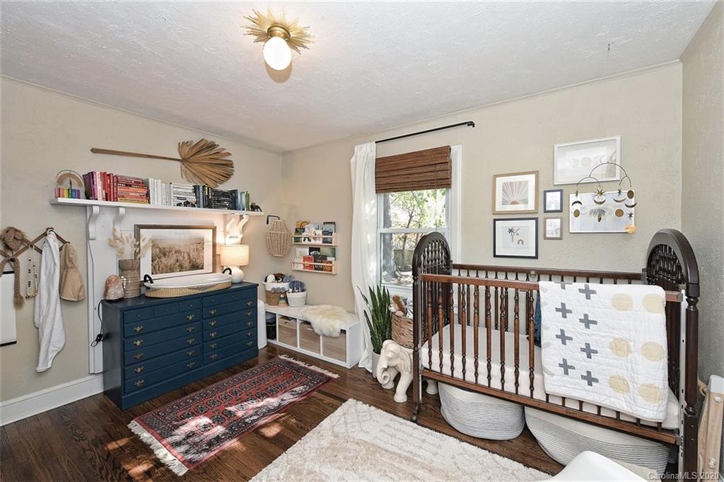 1508 Chippendale Road Charlotte, NC 28205 - Photo 20 of 28 a bedroom with furniture and a window