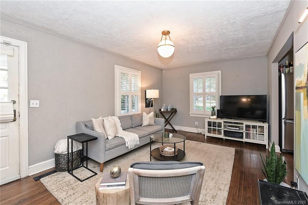 1508 Chippendale Road Charlotte, NC 28205 - Photo 4 of 28 a living room with furniture and a flat screen tv