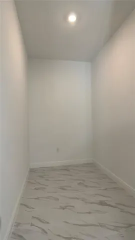 a bathroom with a double vanity sink mirror and toilet